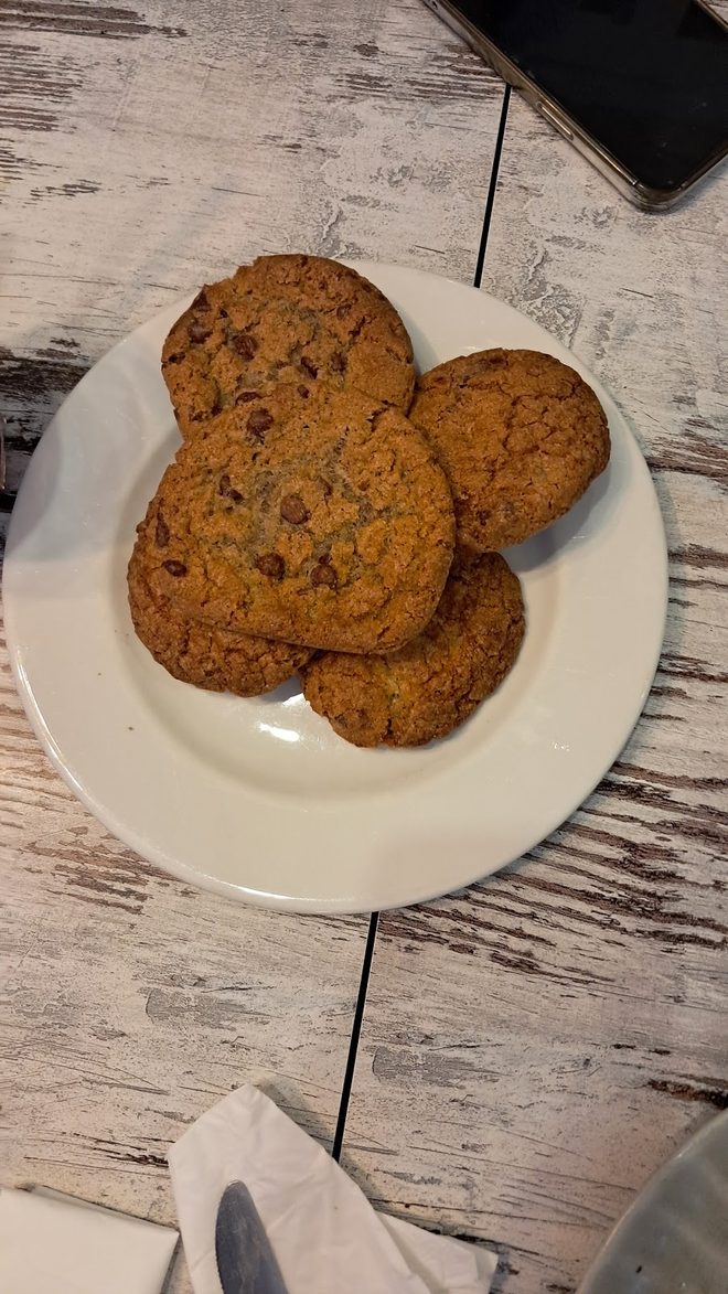 Cookies on a plate on pale wood